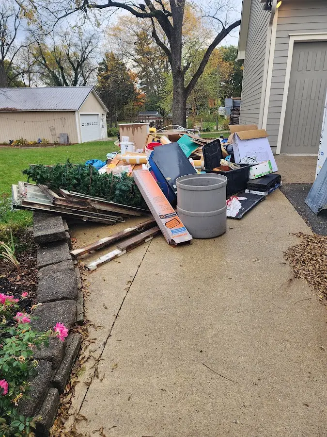 Dumpster being loaded with debris for 3 Yard Dumpster Rental in Cambridge